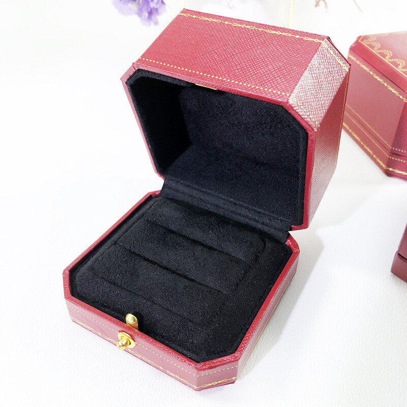 Red jewelry box for proposing with a diamond ring