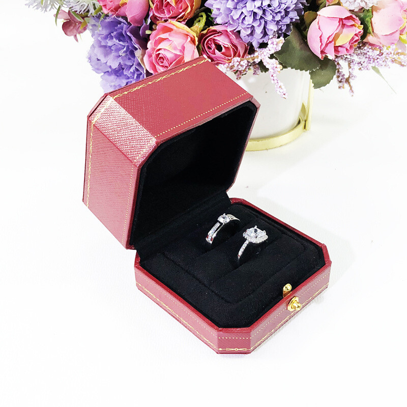 Red jewelry box for proposing with a diamond ring