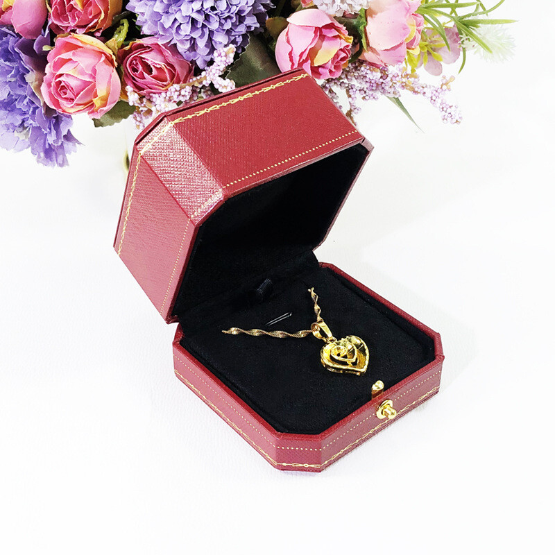 Red jewelry box for proposing with a diamond ring
