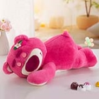 Strawberry bear lying on stomach