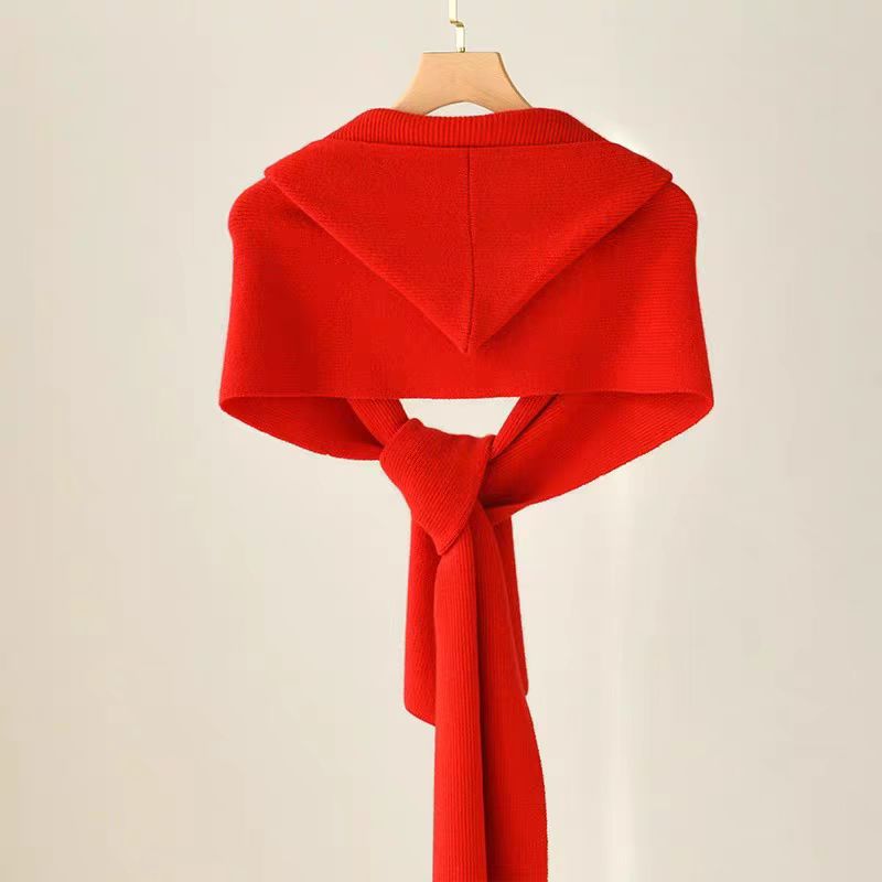 Ladies wearing hats, shawls, and scarves