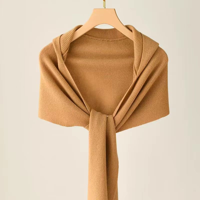 Ladies wearing hats, shawls, and scarves