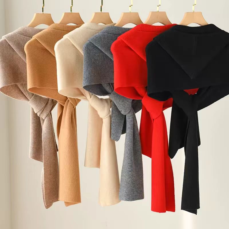 Ladies wearing hats, shawls, and scarves