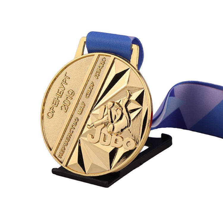 3D gold, silver, and bronze engraved personalized medals for judo, kung fu, karate, and taekwondo, with ribbons.