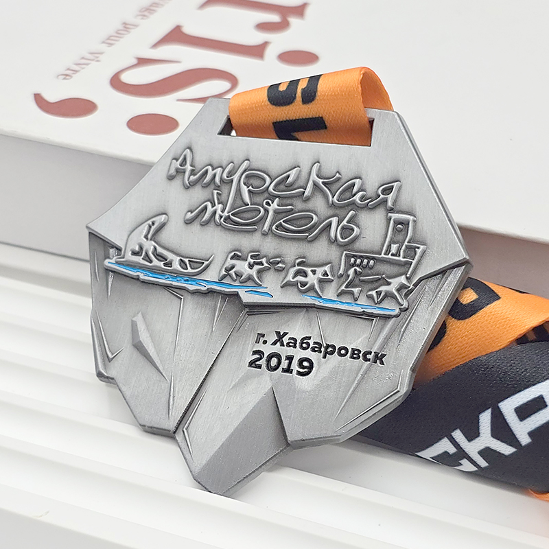 Frosted silver metal medal, commemorative event item, orange and silver color blocking, 3D relief sports collectible.