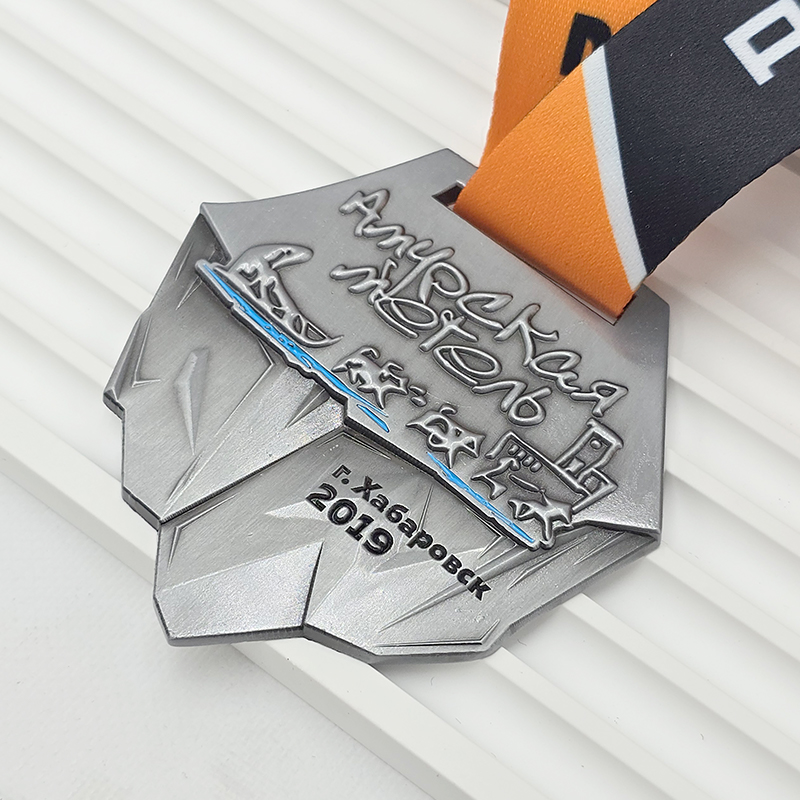 Frosted silver metal medal, commemorative event item, orange and silver color blocking, 3D relief sports collectible.