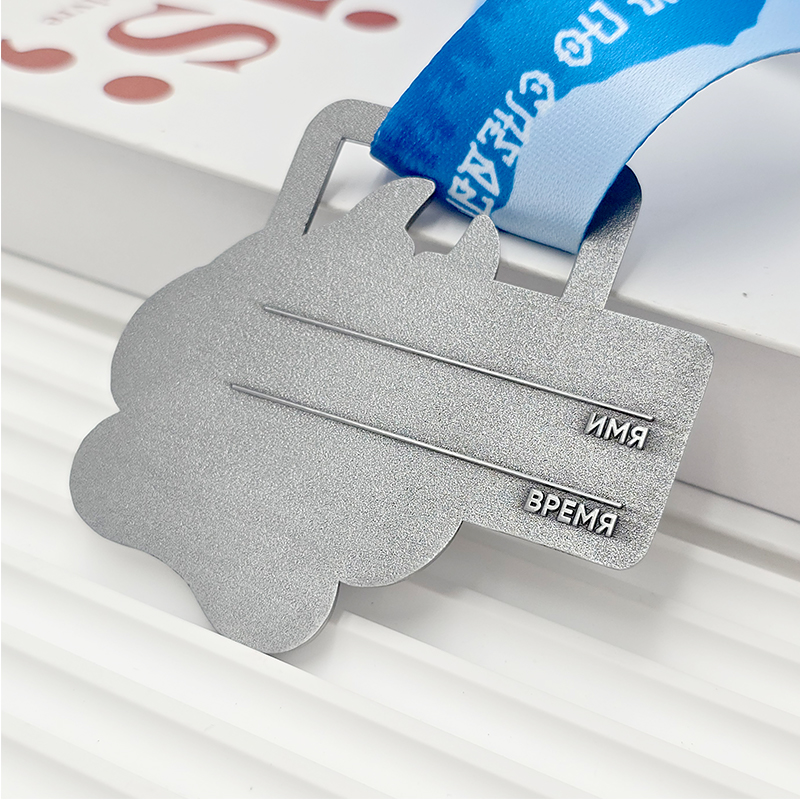 Frosted silver metal medal with bear paw design, commemorative event item, 3D paw print relief, outdoor sports collectible.