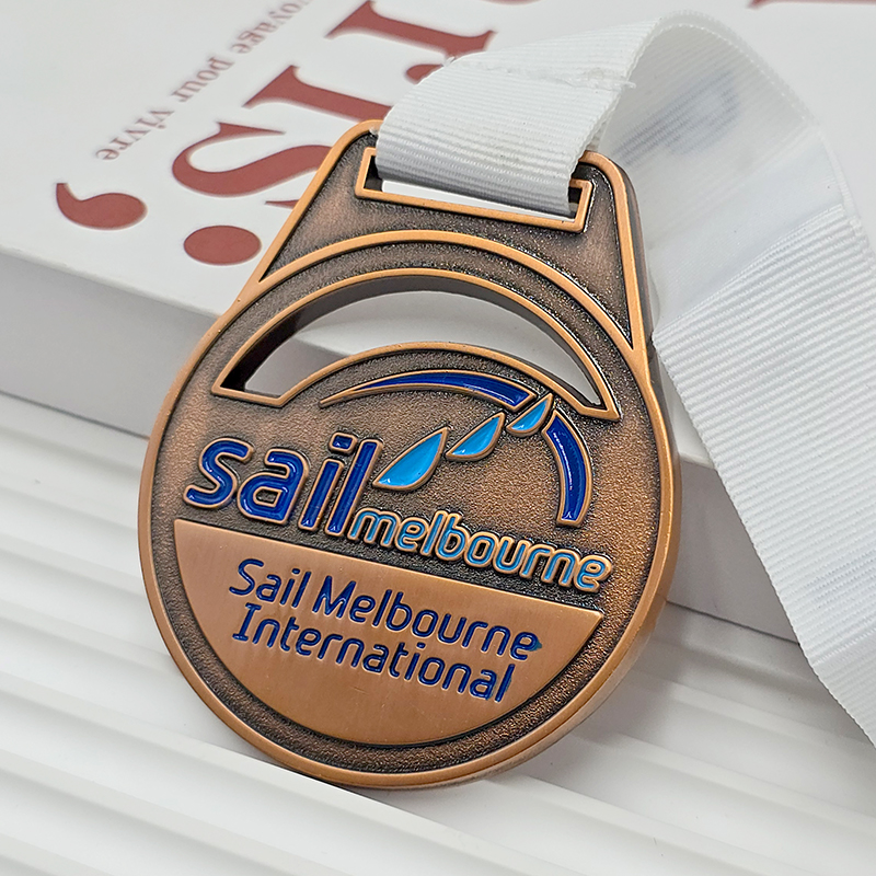 Vintage bronze metal medal, commemorative blue painted sailboat element for the Melbourne International Yacht Race, a collectible nautical event.