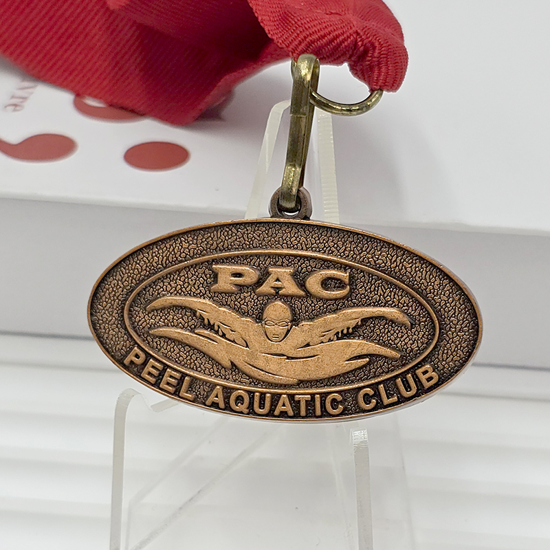 Vintage bronze metal medal, Peel Aquatic Club commemorative swimmer, 3D relief water sports collectible badge