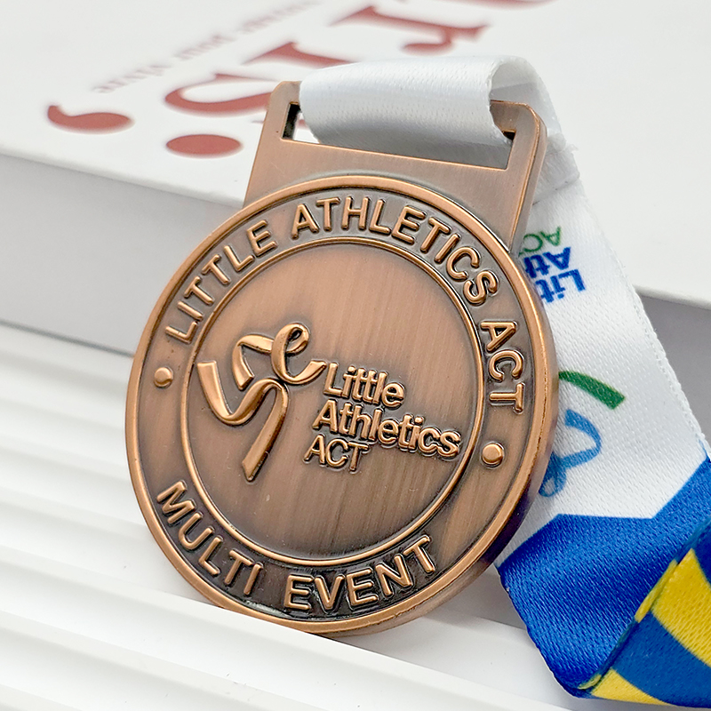 Vintage bronze metal medal, commemorative dynamic relief design for Australian junior athletics combined events, collectible badge for children's sports.