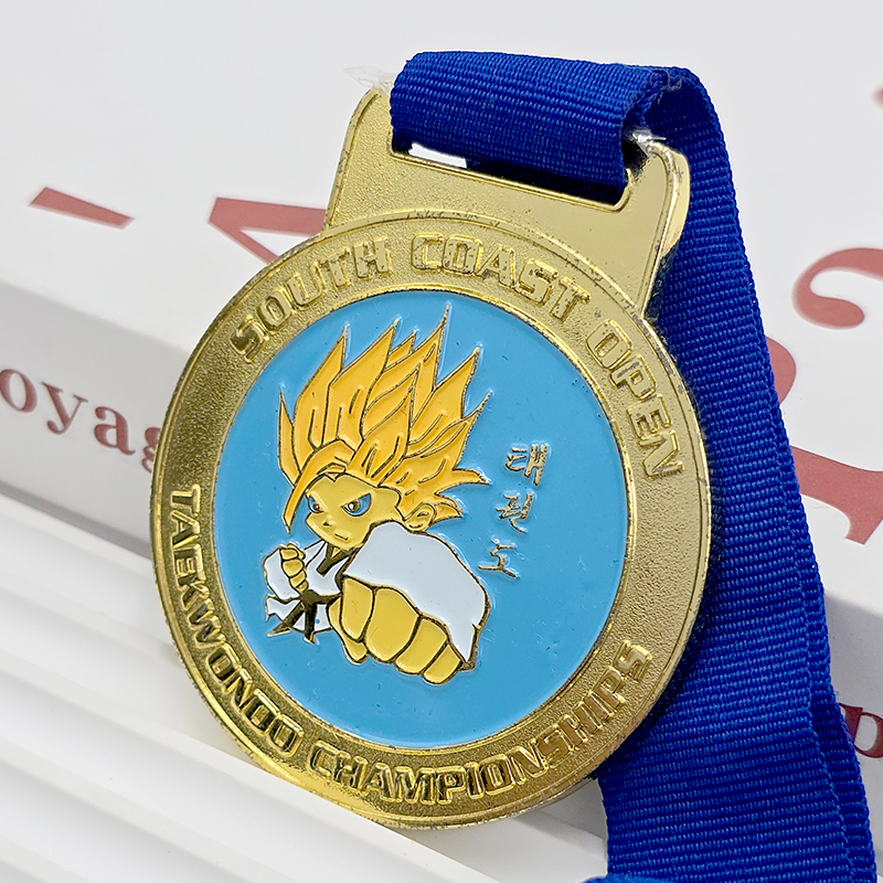Gold and blue contrasting metallic medal South Coast Open Taekwondo Championship commemorative Super Saiyan cartoon relief anime-themed event collectible.