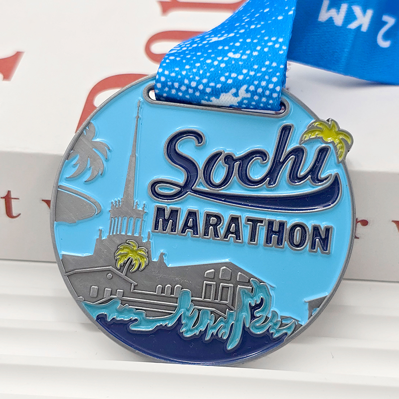 Silver and blue color-blocked metallic medal, Sochi Marathon commemorative city architecture wave relief, seaside race collectible.