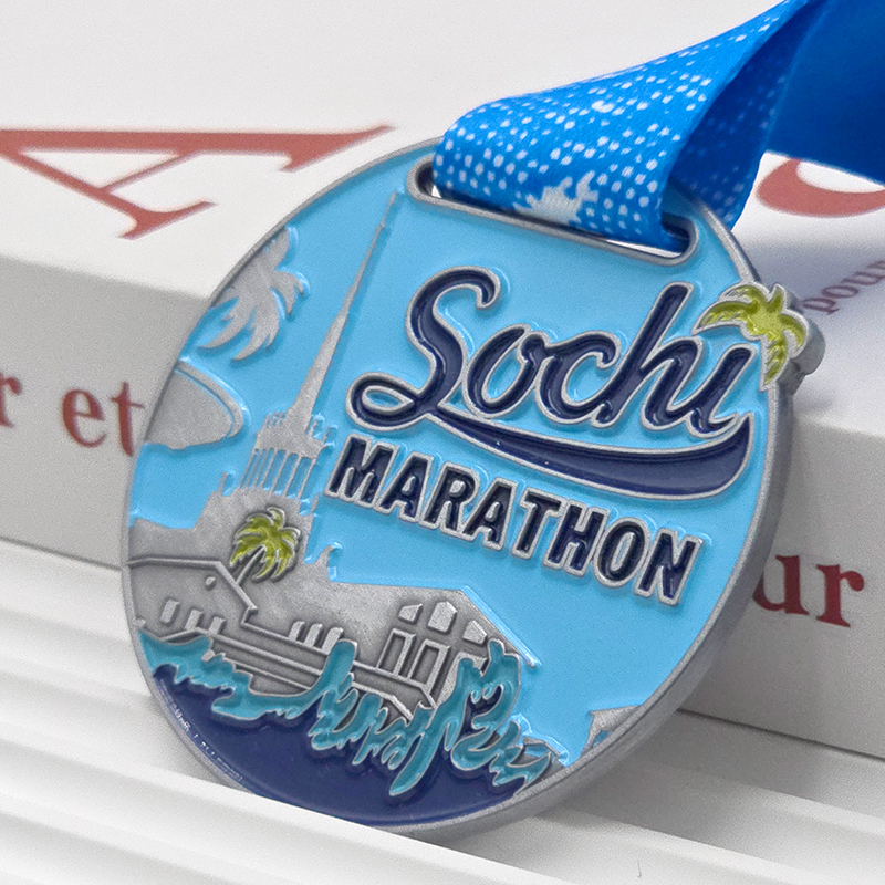 Silver and blue color-blocked metallic medal, Sochi Marathon commemorative city architecture wave relief, seaside race collectible.