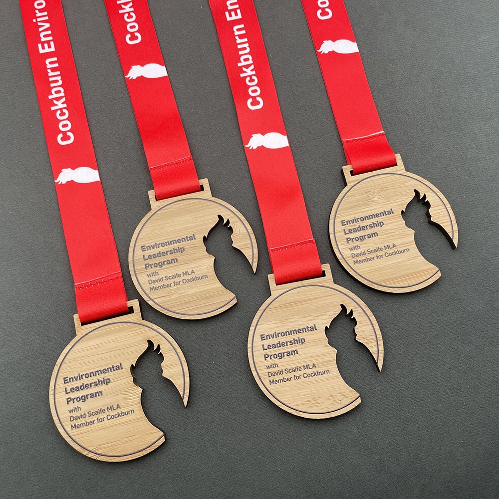 Wooden medals, laser-printed logos, custom medals and trophies