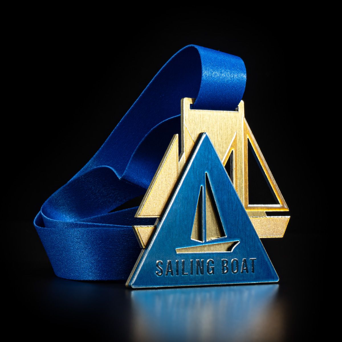Silver sailboat-shaped finisher medal for the Rhodes Premier's Cup Regatta, 2023 commemorative medal.