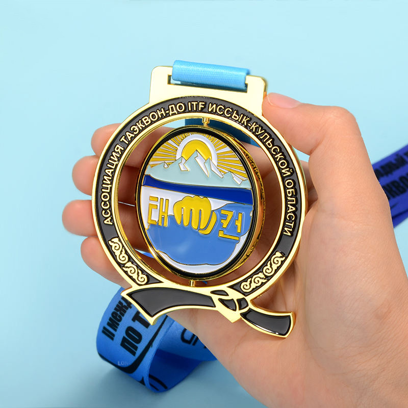 A collection of swimming medals: Gold, Silver, and Bronze shield-shaped / hexagonal / circular relief swimming commemorative badges.