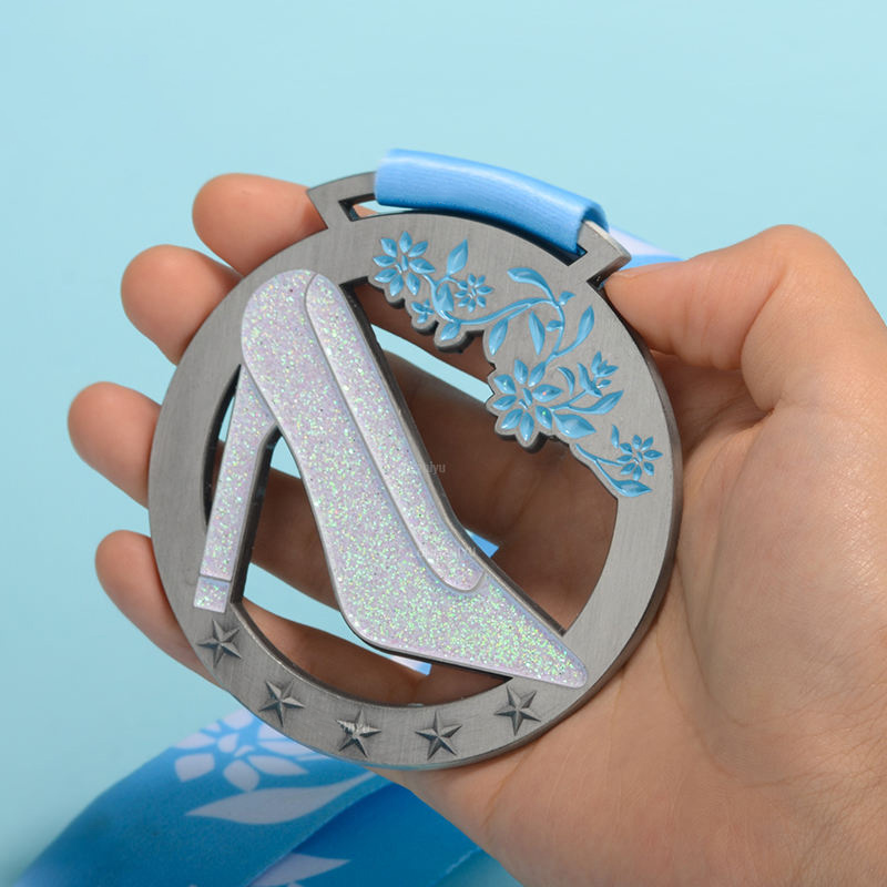 A collection of swimming medals: Gold, Silver, and Bronze shield-shaped / hexagonal / circular relief swimming commemorative badges.