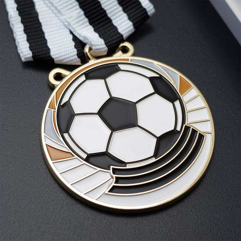Gold football match medal; Black and white enamel football-shaped metal medal of honor.