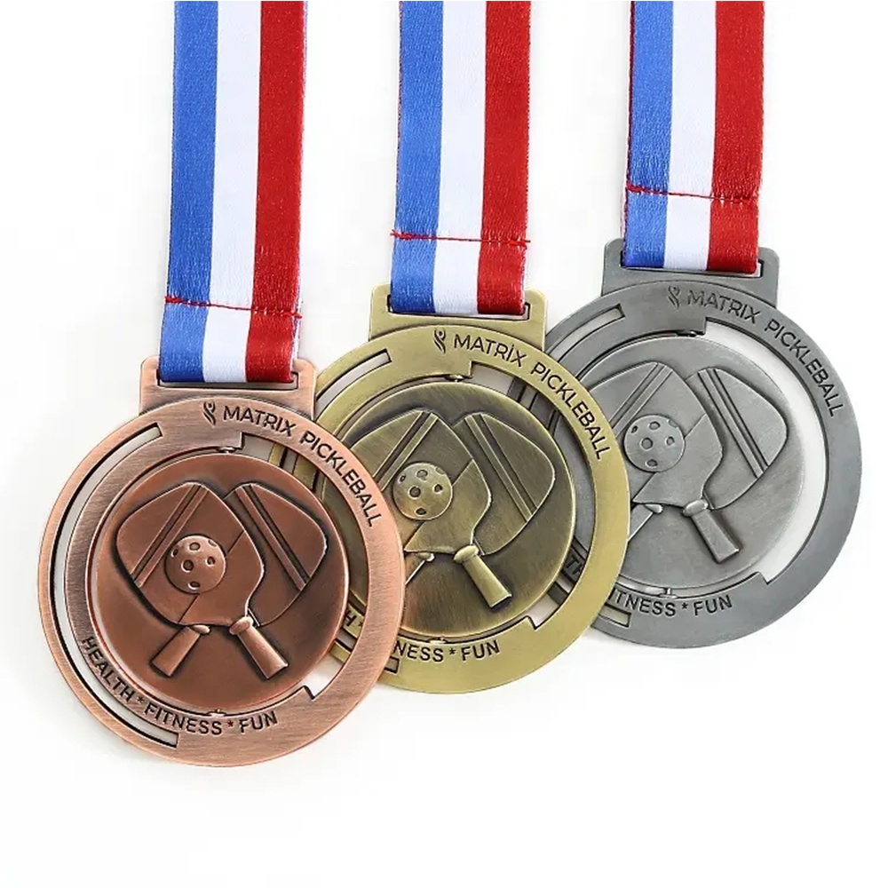 Championship Medal: A round, hollowed-out yellow sphere-shaped medal for sporting events.