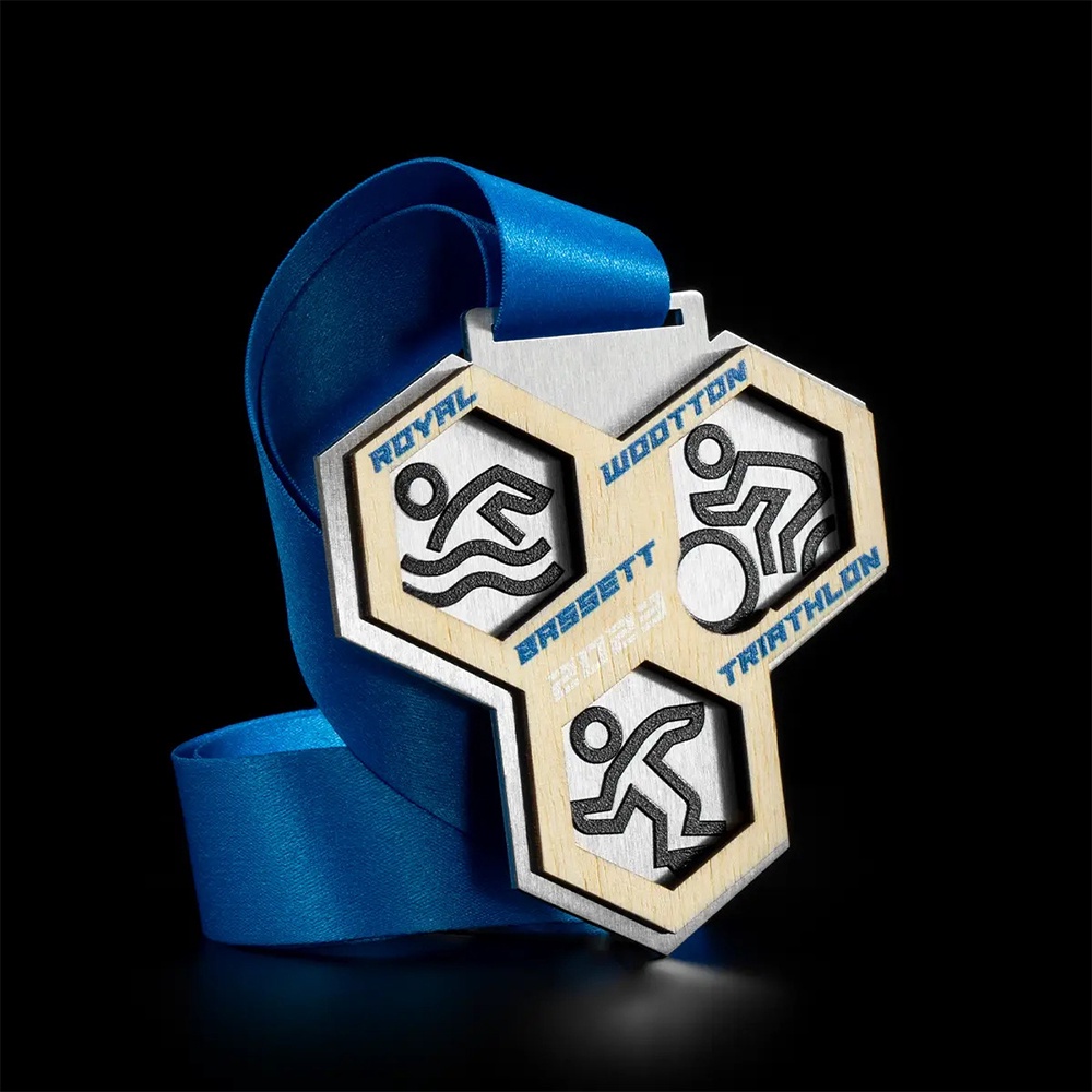 Customized basketball league medals, shield-shaped metal plaques.
