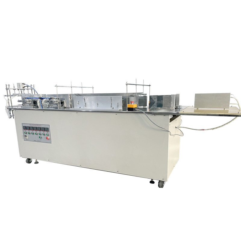 semi-automatic wrapping machine wrapping boxes