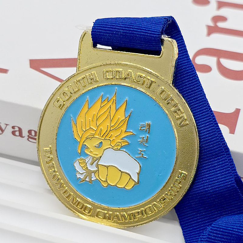 Gold and blue contrasting metallic medal South Coast Open Taekwondo Championship commemorative Super Saiyan cartoon relief anime-themed event collectible.