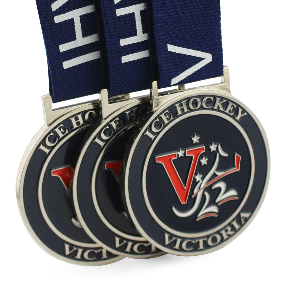 Medalla del Torneo de Hockey sobre Hielo de Victoria: galardón metálico esmaltado en azul