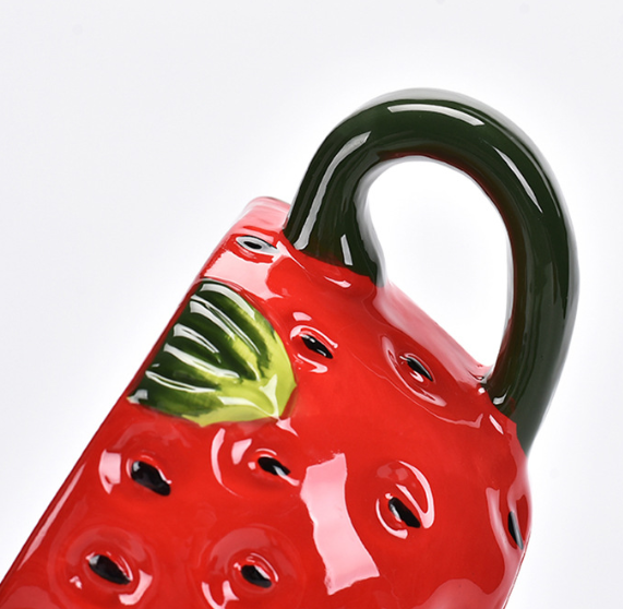 Strawberry-shaped ceramic mug 