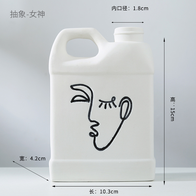 Abstract human face fired ceramic vase