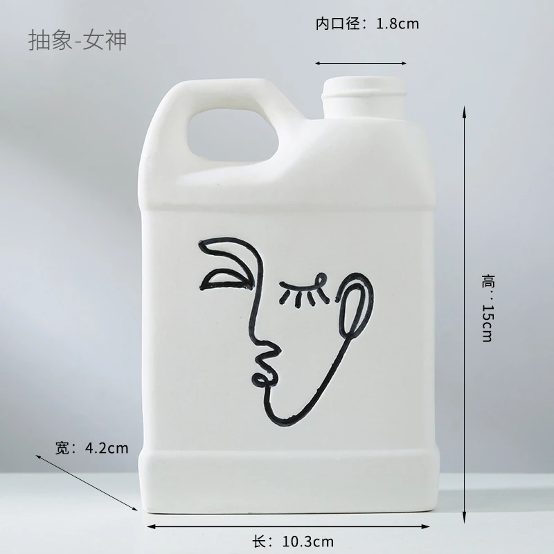 Abstract human face fired ceramic vase