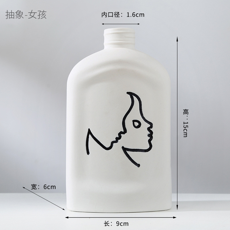 Abstract human face fired ceramic vase