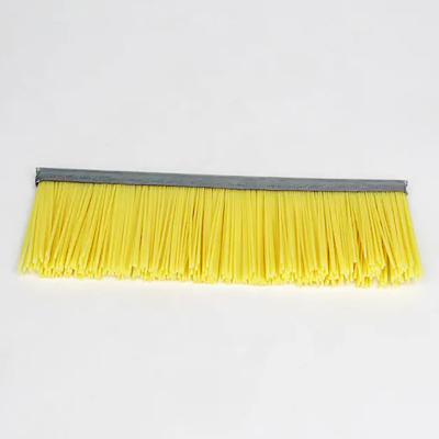 Strip brush for concrete block making machine