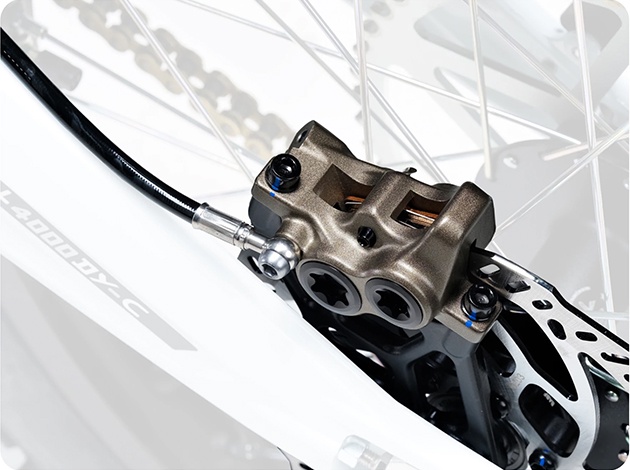 Integrated forged opposed 4-piston braking system