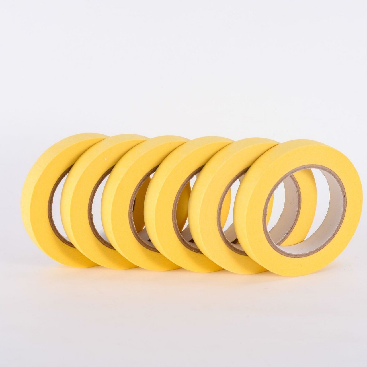 Masked paper tape for spray painting and masking. Hand torn masking tape can be used for writing without leaving residue. Painted decorative masking paper