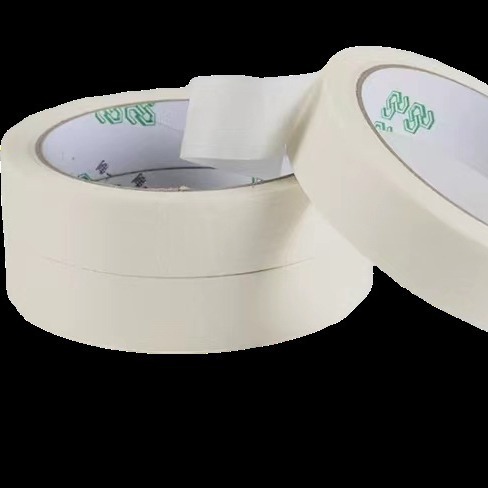 Masked paper tape for spray painting and masking. Hand torn masking tape can be used for writing without leaving residue. Painted decorative masking paper