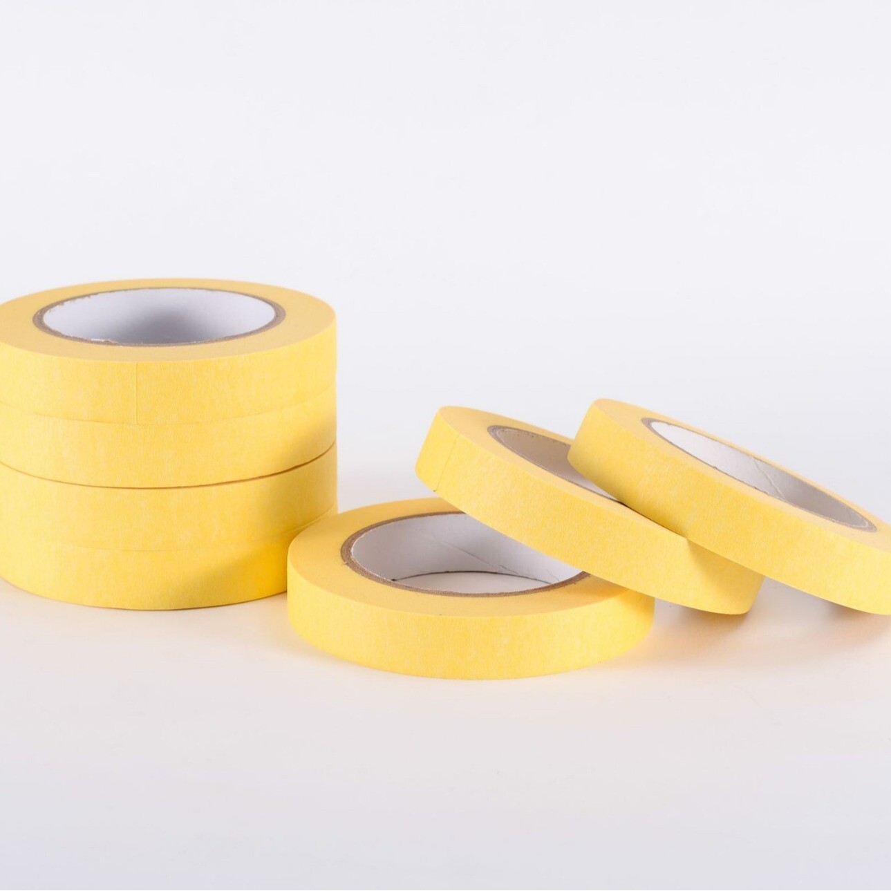 Masked paper tape for spray painting and masking. Hand torn masking tape can be used for writing without leaving residue. Painted decorative masking paper