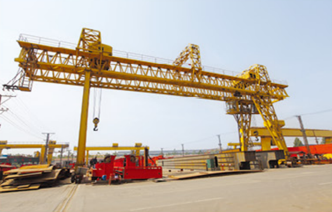 factory produces portal cranes for port use, specifically for unloading heavy loads9