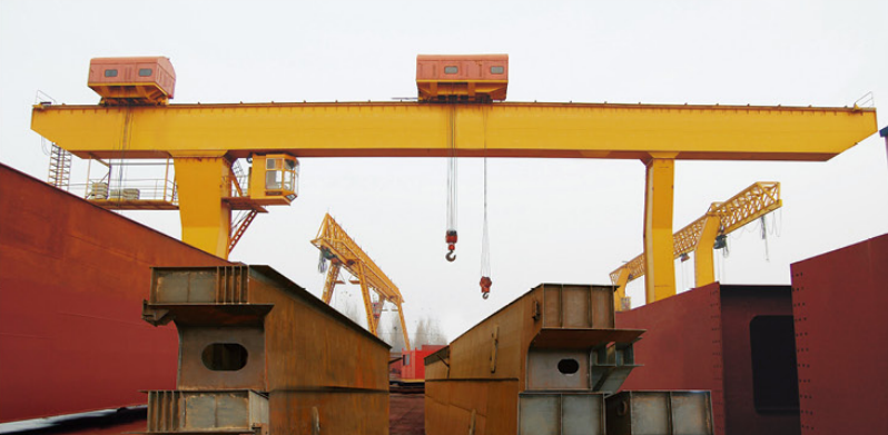 factory produces portal cranes for port use, specifically for unloading heavy loads5