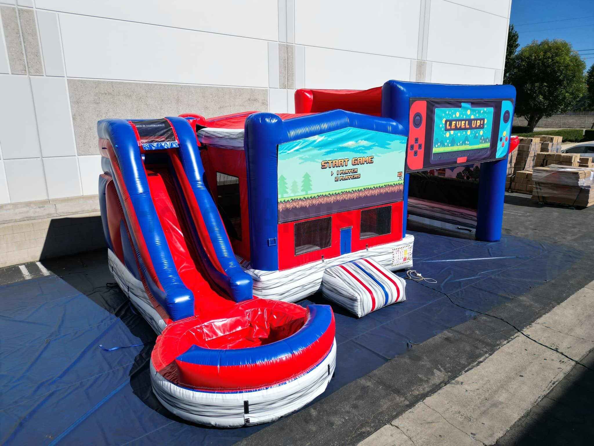Inflatable bouncer with water slide