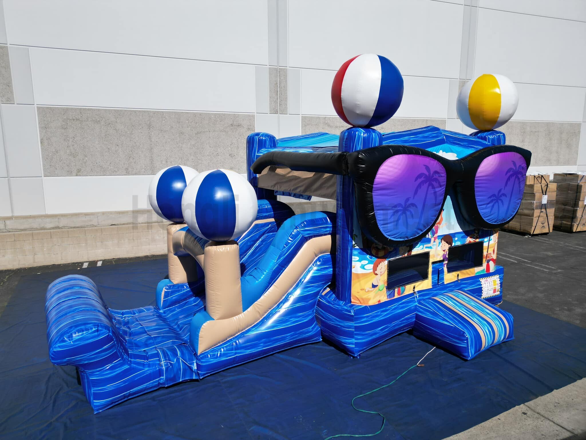 Inflatable bouncer with water slide