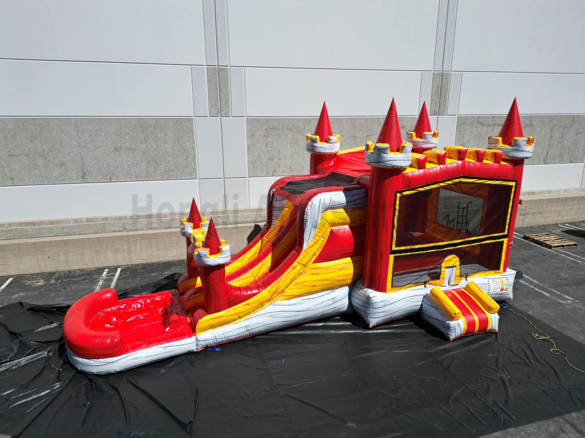 Inflatable bouncer with water slide