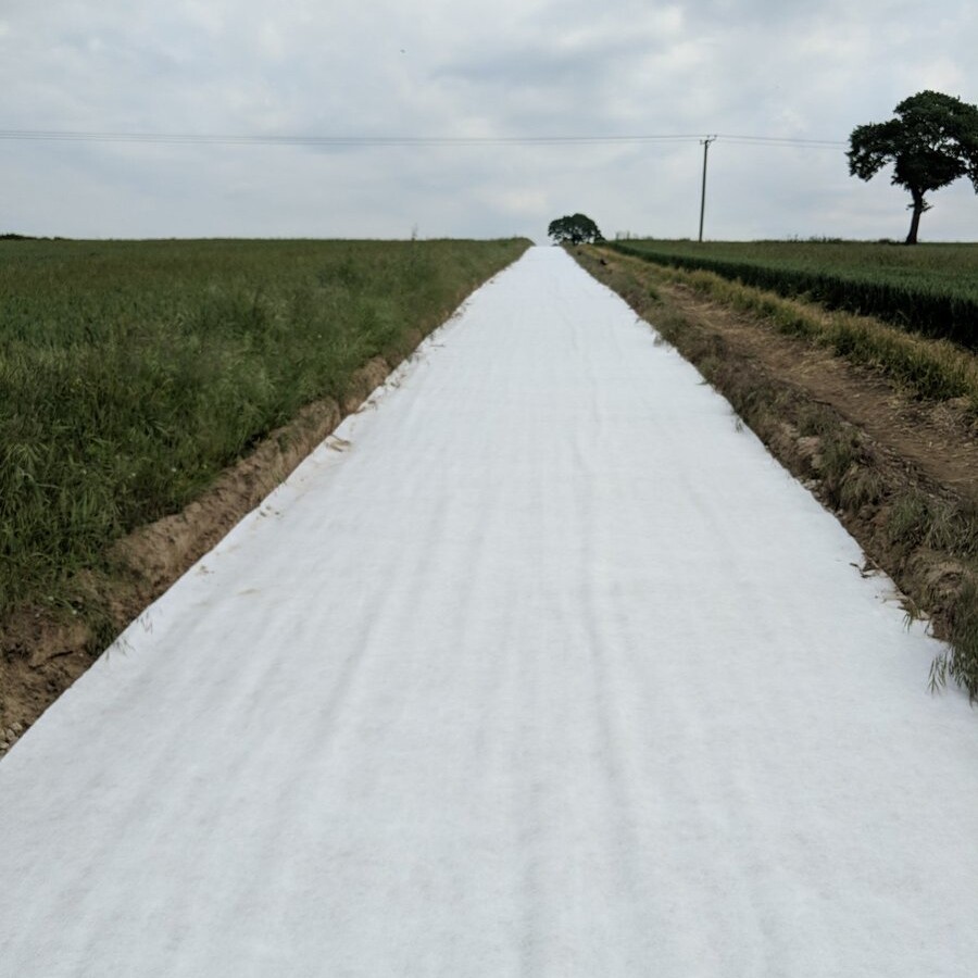 Short fiber needle punched nonwoven geotextile