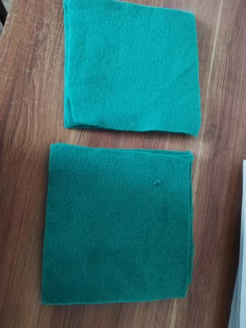 Short fiber needle punched nonwoven geotextile