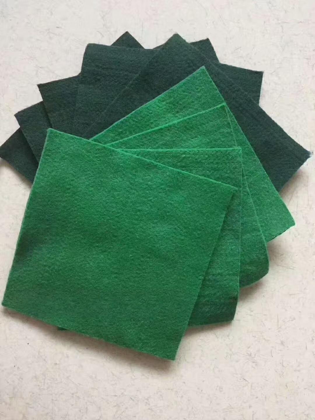 Short fiber needle punched nonwoven geotextile