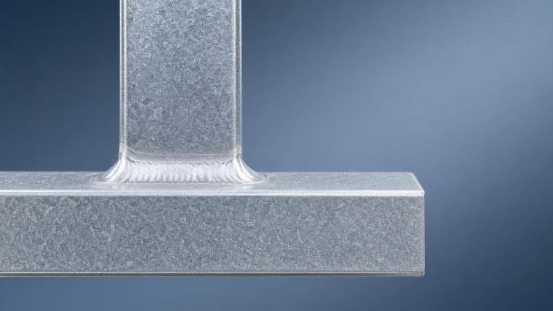 How do structural steel properties change after hot-dip galvanizing at weld seams?