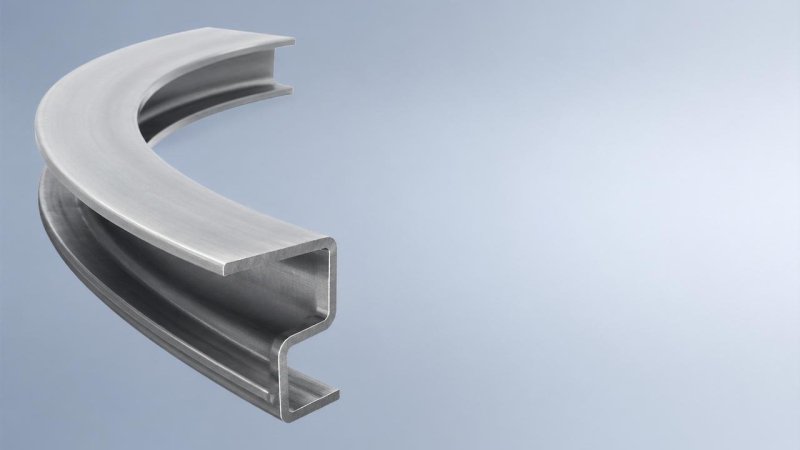 What’s the typical yield loss during structural steel fabrication for curved members?