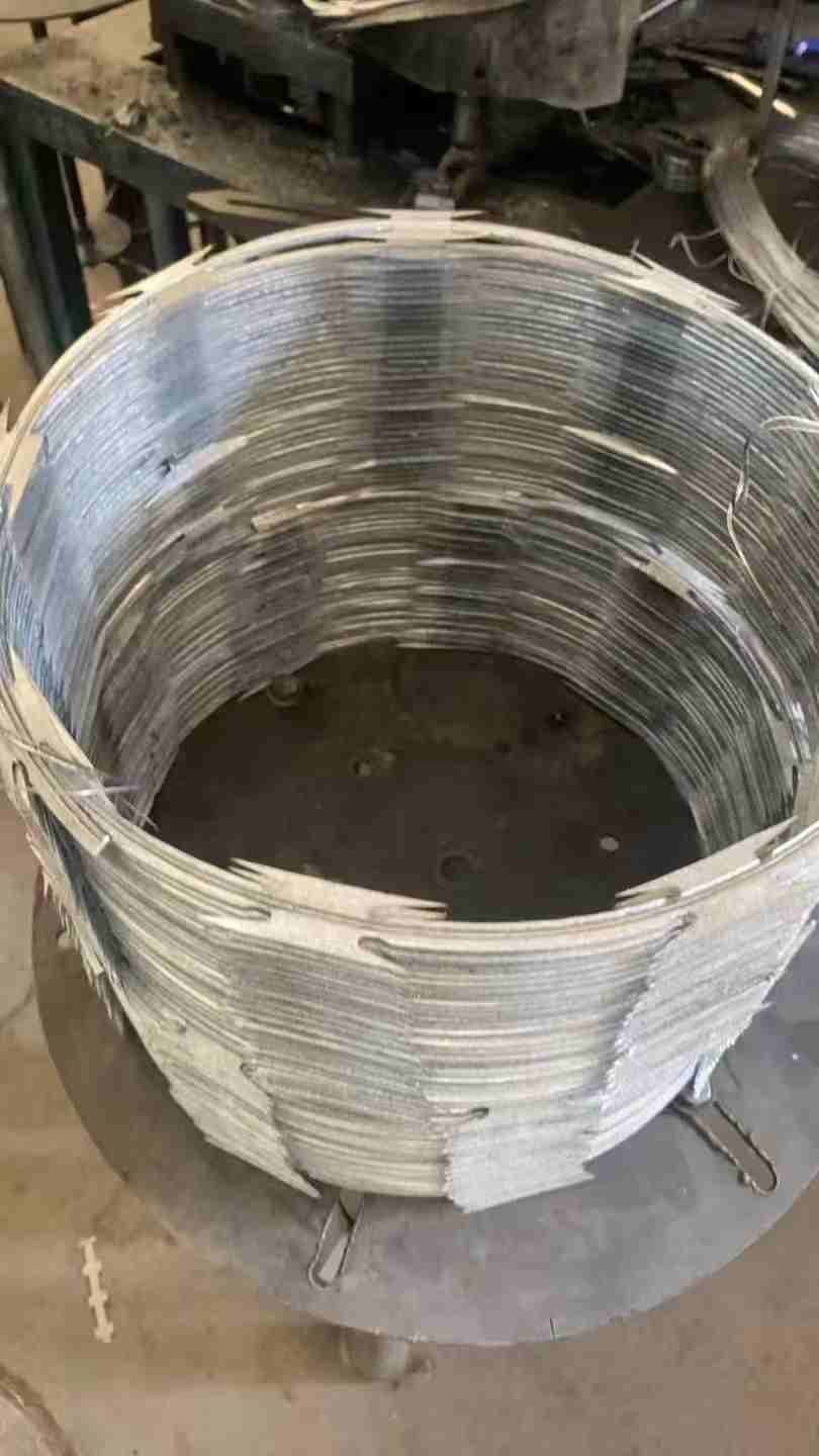 High-strength CBT-65 razor wire coil made from galvanized steel. 33 loops cover up to 25 ft – ideal for security fencing.