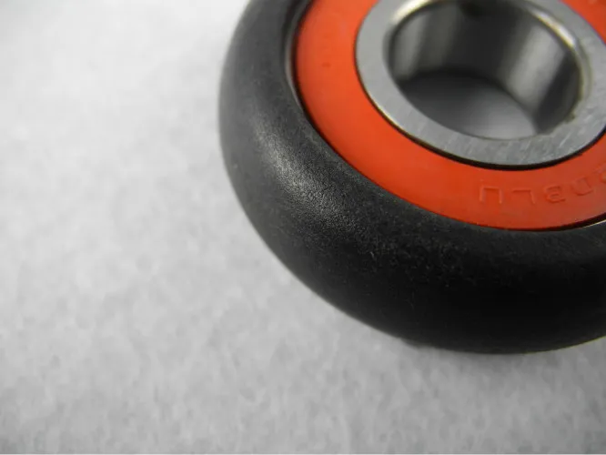 Black Fiberglass filled Nylon Parts , ylon Injection Moulded Ball bearing Wheel
