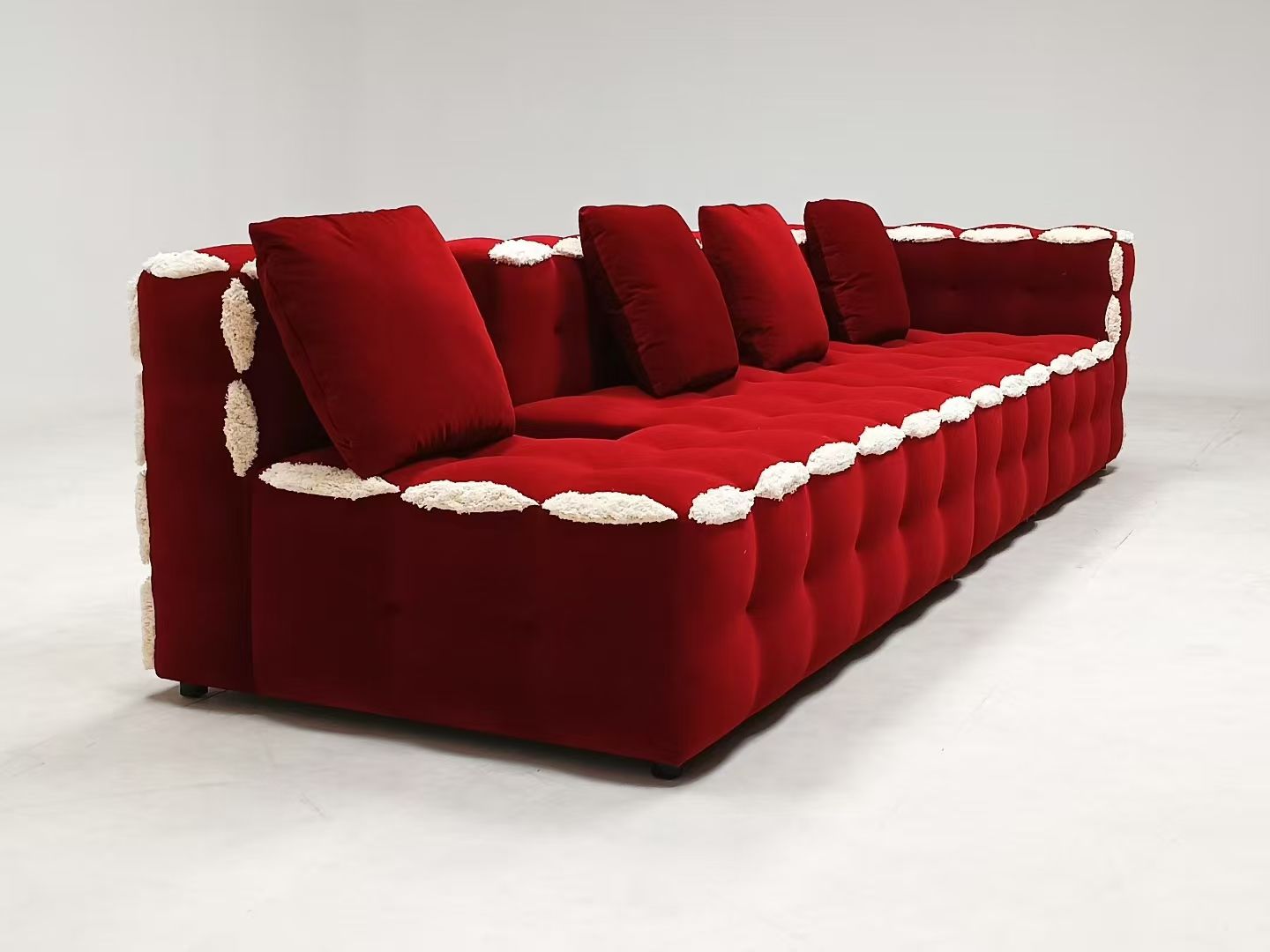 Red velvet L-shaped modern tufted sofa set with white accents, made of microfiber fabric and sponge filling, suitable for living rooms, hotels, and apartments.