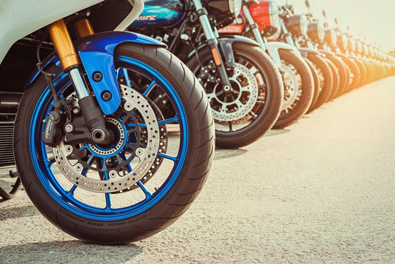 How do motorcycle wheels impact motorcycle performance?